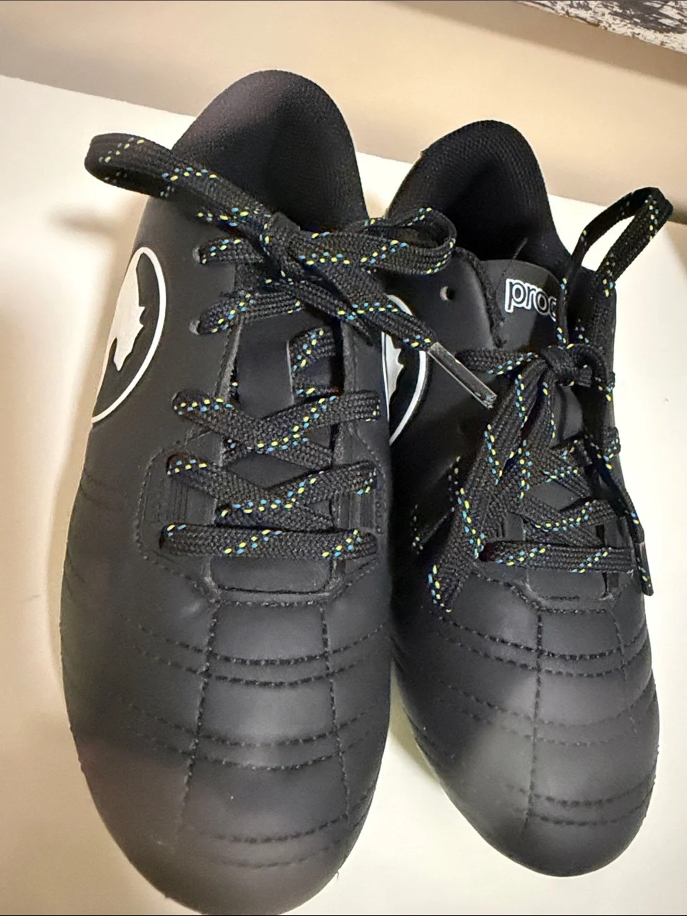 Puma Kids Black Athletic Cleats with Multicolor Speckled Laces